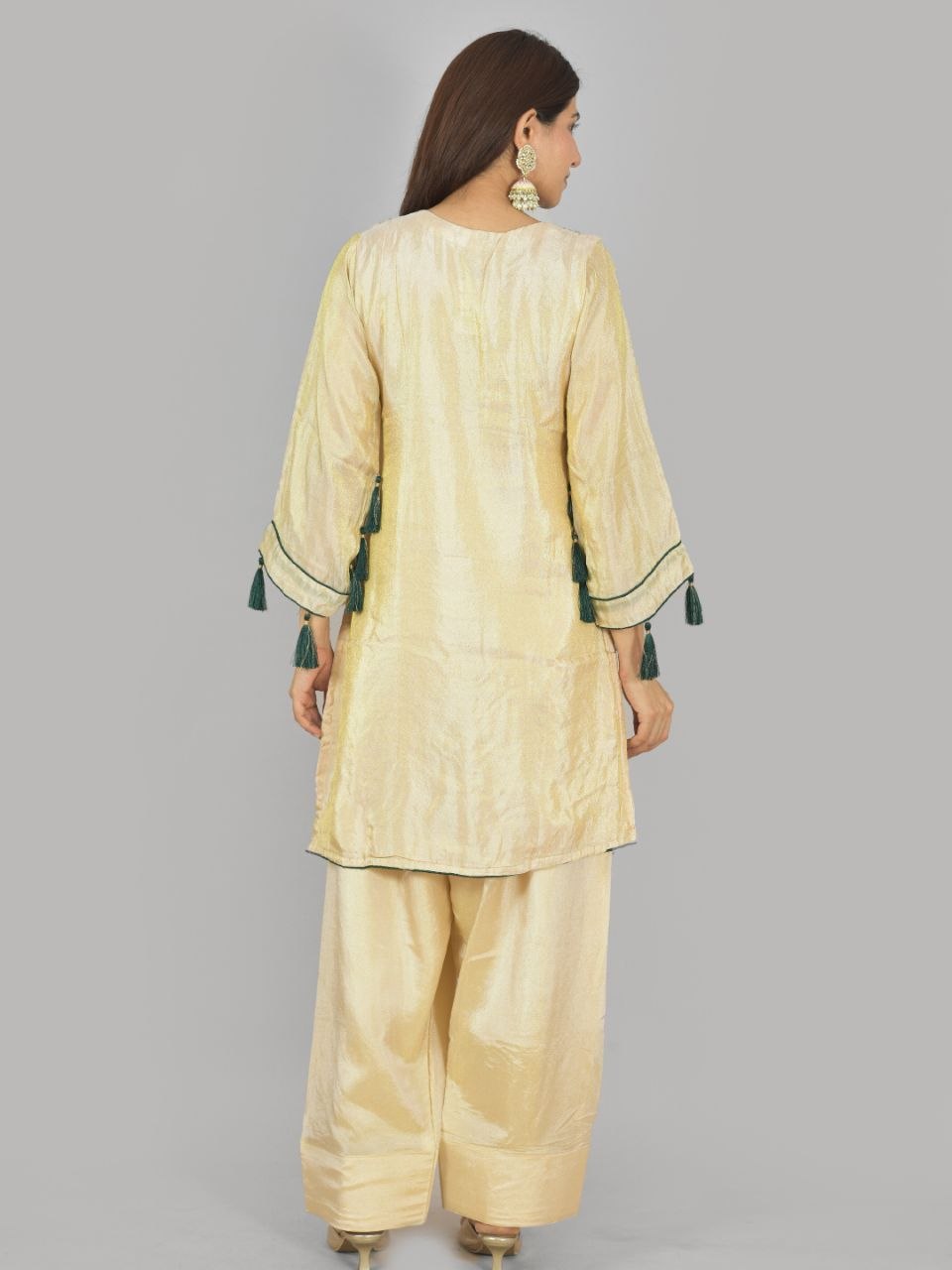 Megha Farsi green suit